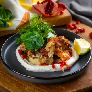 Roasted cauliflower with harissa and tahini yoghurt