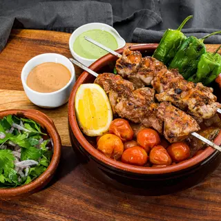 Terracotta Pot and two Pork tenderloin Skewers