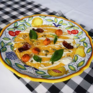 Risotto di zucca con gorgonzola e chips di petto d'anatra affumicata