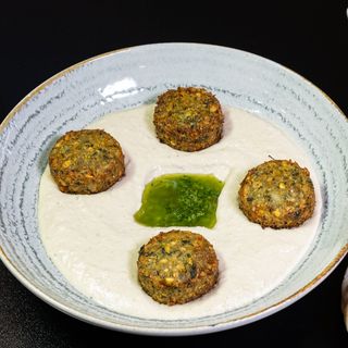 Hummus with falafel in plate
