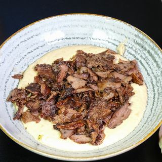 Hummus with beef and lamb in plate
