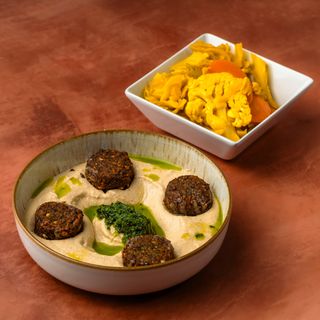Hummus with falafel in plate