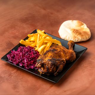 Half chicken on a plate