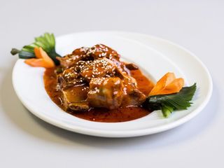 Coaste de porc in sos acru-dulce