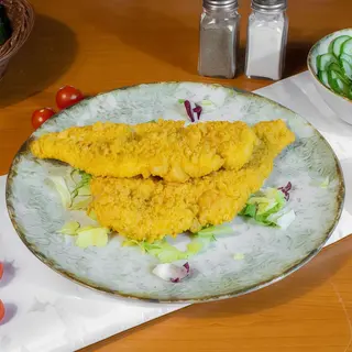 Schnitzel de pui in fulgi de porumb