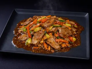 Limbă de porc în sos picant