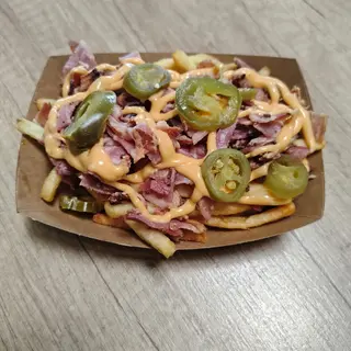 Cartofi cu bacon , sos cheddar și Jalapeno 240gr