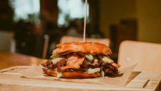 Double smash burger with tomato or red onion slices