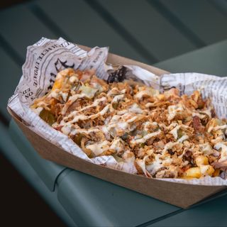 TOPPED FRIES WITH SMOKED CONFIT CHICKEN TIGHS
