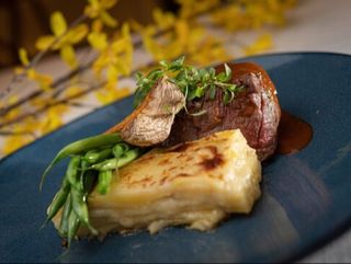 BEEF TENDERLOIN WITH GRATINED POTATOES AND MUSHROOM SAUCE