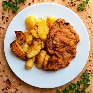 Snitel de porc si cartofi aurii