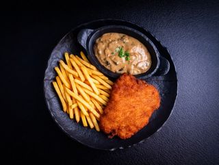 Meniu Schnitzel de pui cu sos de ciuperci