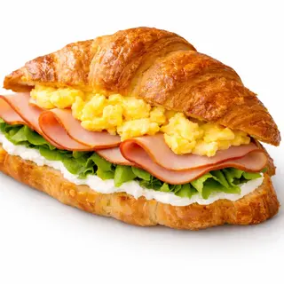 Croissant uns cu unt și prăjit, cu cremă de brânză, șuncă de curcan & scrambled eggs