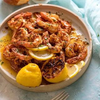 Grilled shrimp with garlic, prawns and fries