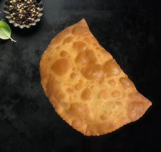 Chebureki with salty cheese