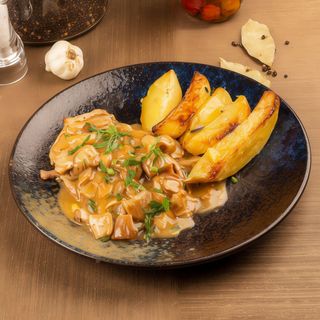 Suino con funghi porcini