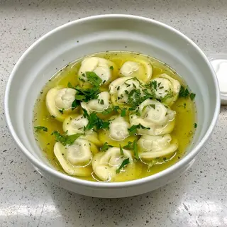 Dumplings "Stroganov" in broth