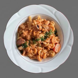 Pasta with shrimp and black tomatoes
