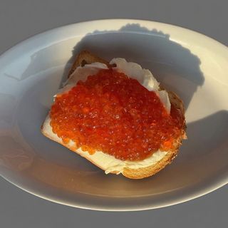 Sandwich with red caviar and whipped butter