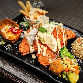 Plats Escalope de poulet Panée