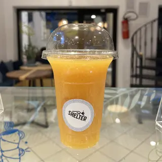 Jus de pêche mangue orange