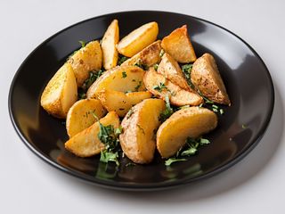 Картопля по-селянськи з часником та зеленню (150г)