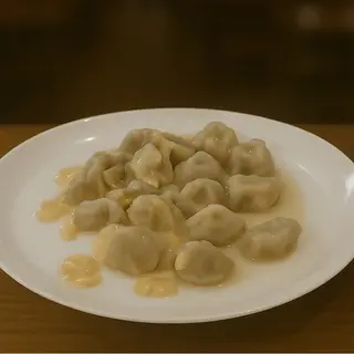 Пельмені у вершковому соусі (230г)