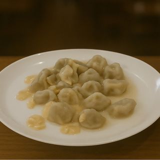 Пельмені у вершковому соусі (250г)