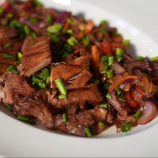 Глазуровані свинячі ребра з соусом конфі