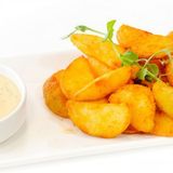 Картопляні дольки з часниковим соусом (150/30г)