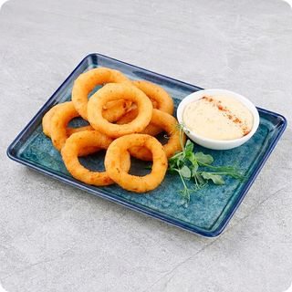 Цибулеві кільця з часниковим соусом (130/50г.)
