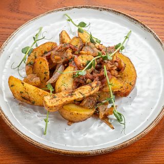 Картопля печена з травами та хрумкими шкварками (180г)