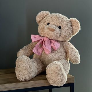 Ведмедик кучерявий з бантом 65 см