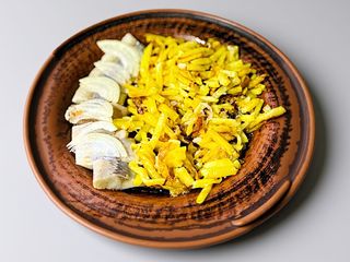 Смажена картопля з оселедцем