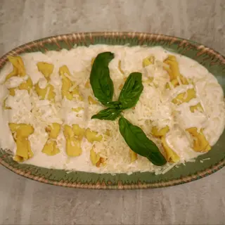 Ravioli al coniglio con demi-glace alla panna