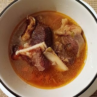 Boiled beef with an assortment of steamed foods