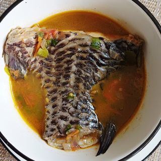 Boiled fish with assorted steamed or boiled foods