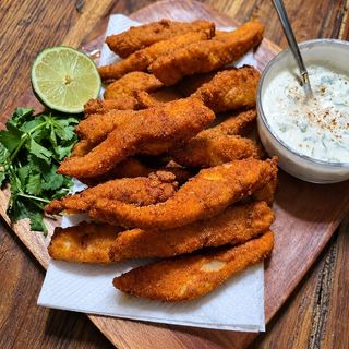 Crispy, golden fish fingers with a tender, flaky fish centre—perfect as a tasty snack or starter.
