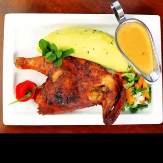 Oven 1/2 chicken served with an accompaniment