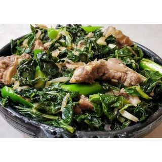 Gomen Besiga Served With Injera