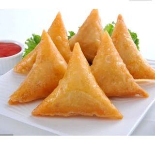 A pair of vegetable samosas