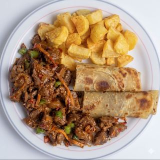 Wet fried Meat served with Potatoes and chapati