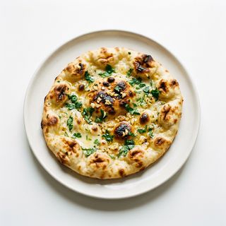 Pan Naan Con Queso Y Ajo (1 Ud.)