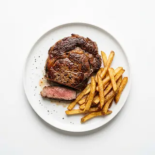Bistec De Ternera Con Guarnición