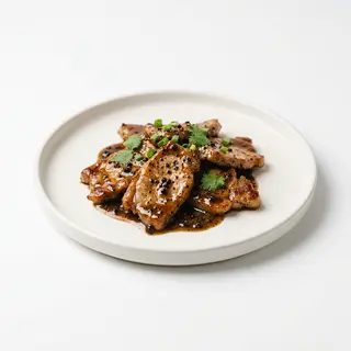 Cerdo Con Salsa A La Pimienta Negra