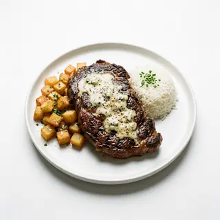 Entrecot En Salsa Roquefort Con Patatas Y Arroz