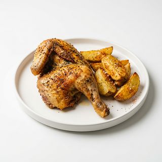 Medio pollo asado con patatas