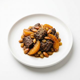 Tajine De Ternera Membrillo O Pera Con Sésamo Pasas Y Almendras