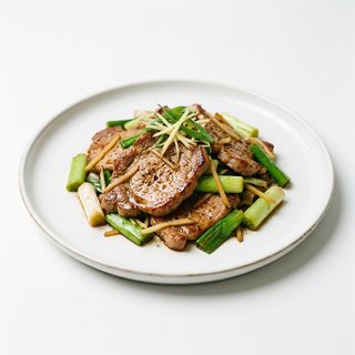 Cerdo Con Puerros Y Jengibre