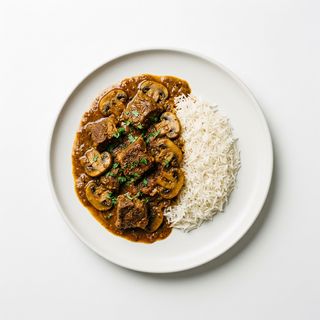 Curry De Cordero Con Champiñones